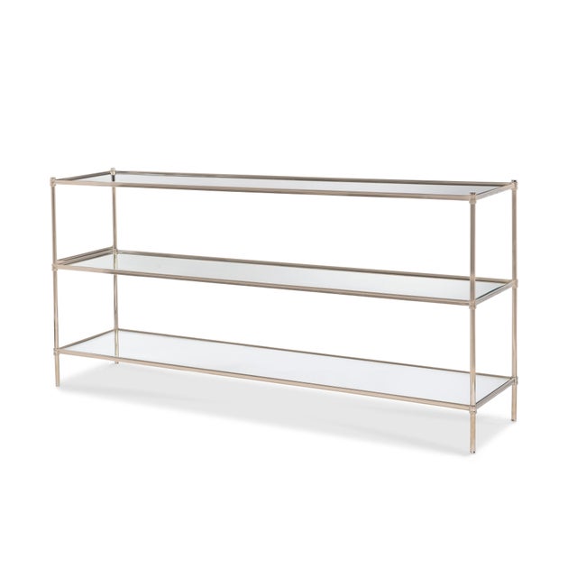 Refined nickel console table with small, elegant casters and tempered glass shelves. Polished finish.