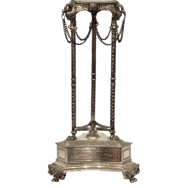 A large glass orb on an elegant Empire style silver plate footed tripod base. Crystal ball measures 8 inches in diameter....