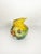 Yellow ceramic pitcher with floral decoration, made in France. This charming vintage pitcher captivates with its vibrant...