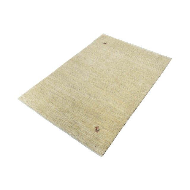 This elegant Gabbeh Loribaft rug was meticulously handcrafted by nomads and impresses with its simple beauty and high-...