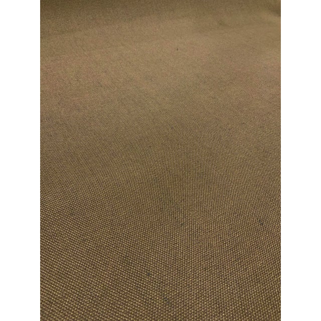 This solid woven fabric is made of taupe and green threads, It has a soft hand and is suitable for upholstery, drapes, and...