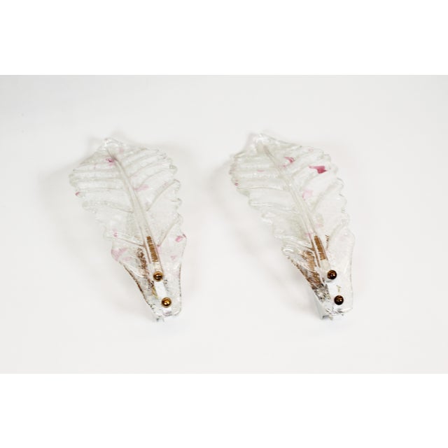 Pair of Italian Murano glass wall lamps, produced during the 1980s. Both are in very good and undamaged condition, with...