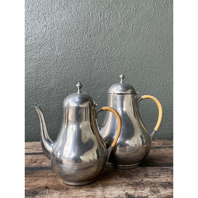 This elegant pair of vintage coffee pots masterfully blends mid-century industrial polish with organic, coastal textures....
