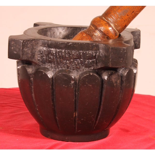 Superb 18th-century black marble mortar with its pestle. Beautiful marble with a superb patina and engraved GP underneath....