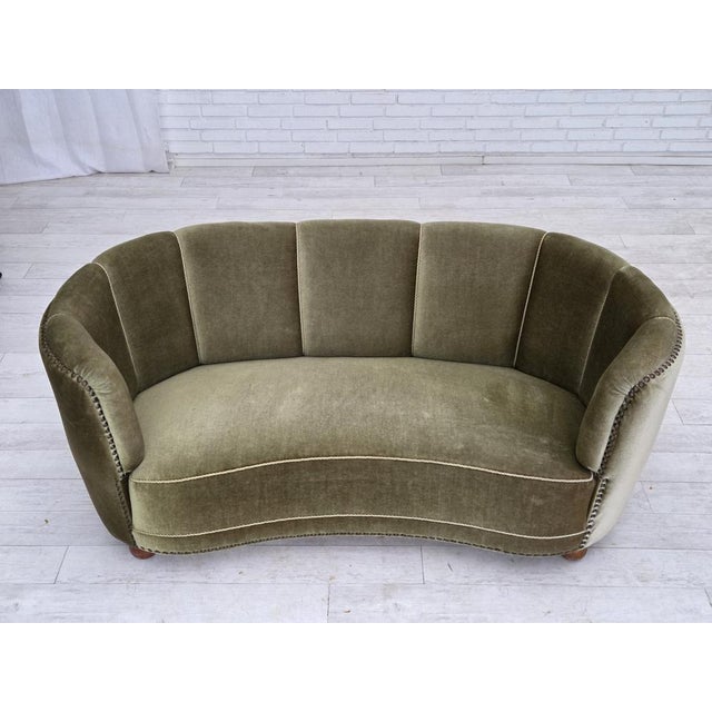 1970s, 2-seater Danish "Banana" sofa. Original green furniture velour, oak wood legs, brass springs in the seat. Original...