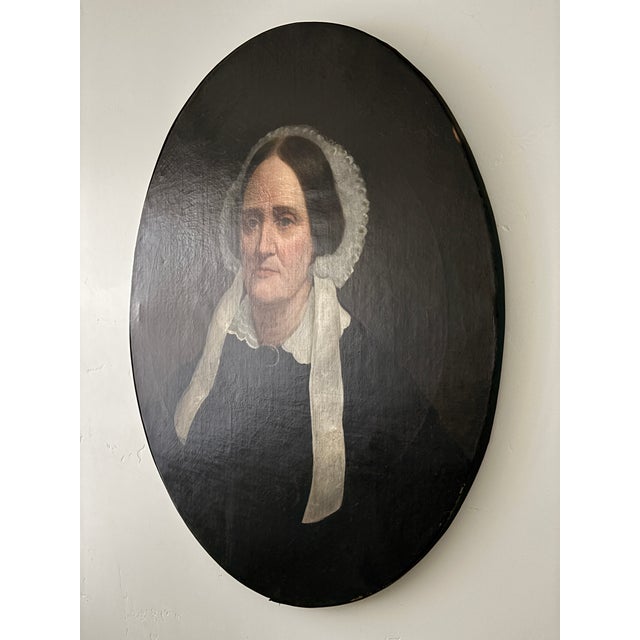 Antique mid-19th century American, large oval, oil on canvas Portrait of a Woman. This carefully executed painting...