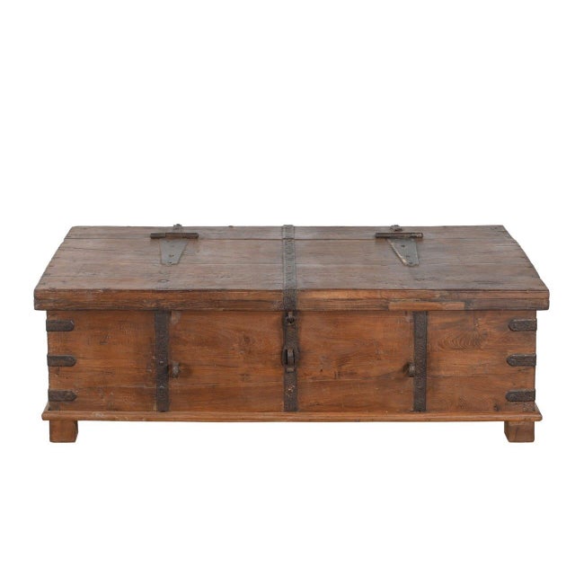 Crafted from solid teakwood, this Antique Indian Blanket Chest/Coffee Table features a beautiful natural patina and hand-...