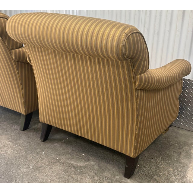 Handsome pair of George smith style chairs featuring a striped upholstery and classic English rolled arms, tight back,...