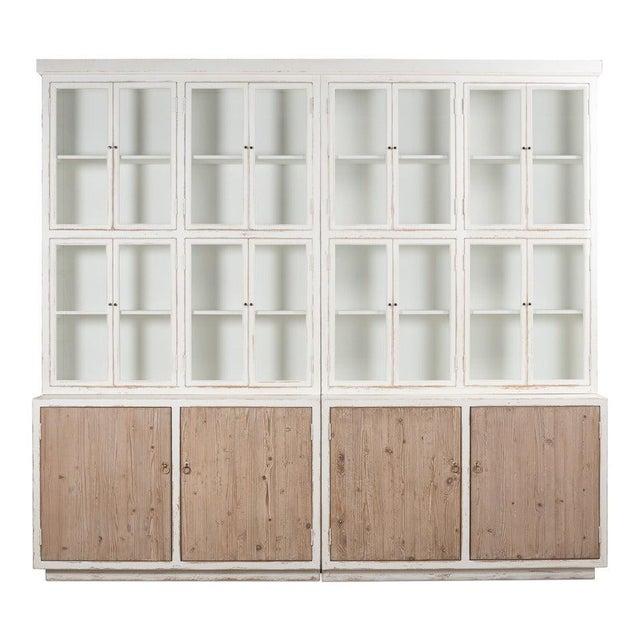 Rising more than eight feet and spanning nearly nine and a half, the pine case has the scale and presence of architectural...