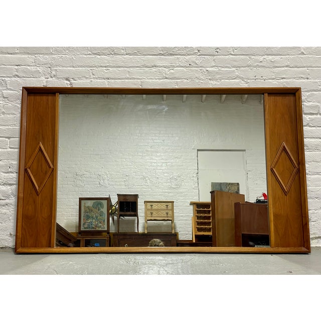 Huge Mid Century Modern Walnut "Diamond" styled Mirror by Albert Parvin, circa 1960's. Lovely vintage condition with only...