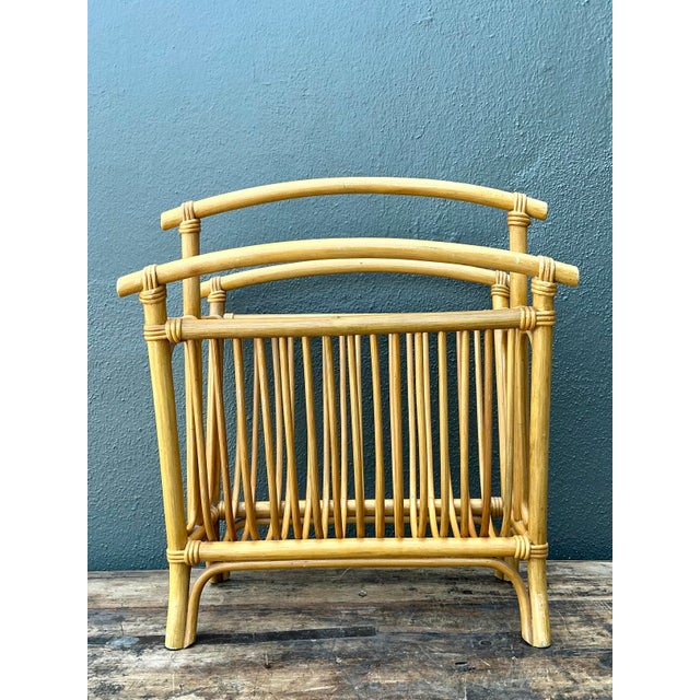 Add a touch of organic warmth and bohemian elegance to your interior with this iconic Mid-Century Modern magazine rack....