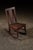 Antique mahogany rocker. This rocker dates to the early 20th century and reflects the pared-down sensibility of the...