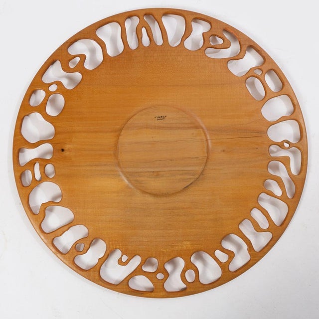 Turned wood plate with a carved reticulated edge by J. Lorch 2007