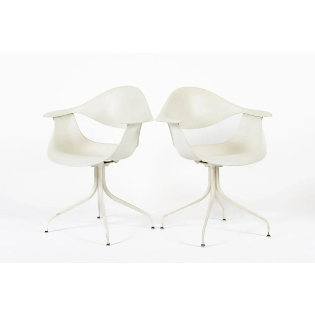 These classic mid century modern white “Swag” chairs were designed by George Nelson in 1958 and produced by Herman Miller...