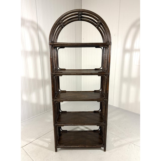 Sturdy large dark rattan rack / display/ book rack. 5 wooden shelves. 1970’s. In very good condition with minimal wear of...