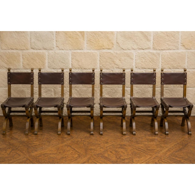 Set of Six Renaissance-Style Oak and Leather Chairs An elegant set of six solid oak chairs in the Renaissance style,...