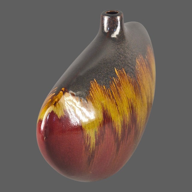 This Mid-Century-Modern Style Abstract Shape Drip Glaze Pottery Vase is a unique and artistic piece of décor for any home....