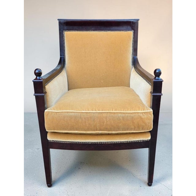Baker Furniture Federal Revival upholstered armchair, crafted in mahogany and distinguished by its refined Neoclassical...