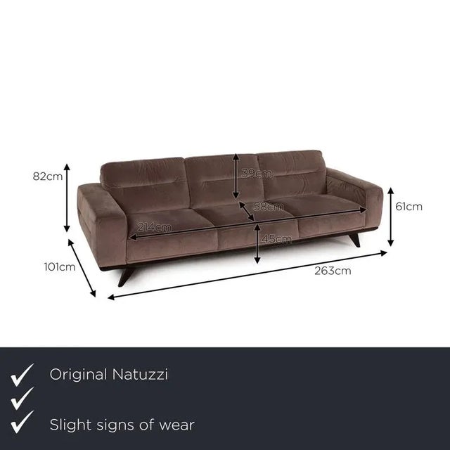 The Audacia three-seater by Natuzzi is upholstered in a brown fabric and stands on elegant black legs. It features a...