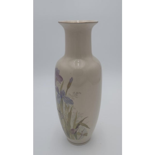 This exquisite vintage Japanese porcelain vase features a delicately hand-painted scene of blooming irises in soft shades...