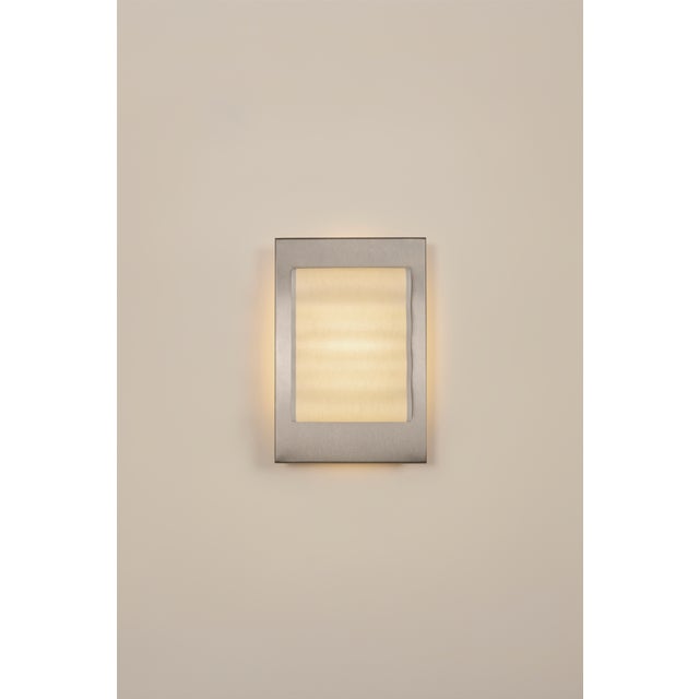 Introducting Frame, a collection of handcrafted wall sconces. Featuring a minimalist design, simple forms, and the subtle...