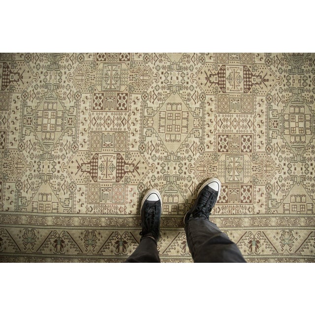 :: Allover covered field in geometric repeating shield medallion design motif arranged in three columns atop a covered...