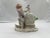 Meissen, 19th century. A fine quality Meissen porcelain figurine depicting a young boy playing with his pet bird. The...