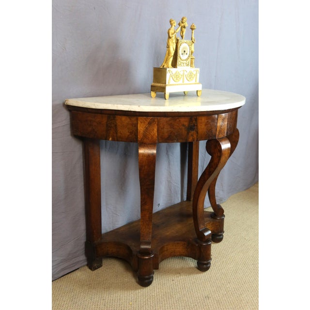 Restoration period console table with scrolled handles. Carrara marble top. This original console table, with its three...