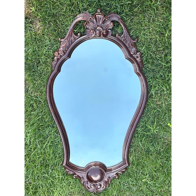 This large mirror was made by Furniture Studios, Inc., located in Grand Rapids, Michigan. Their advertising slogan...