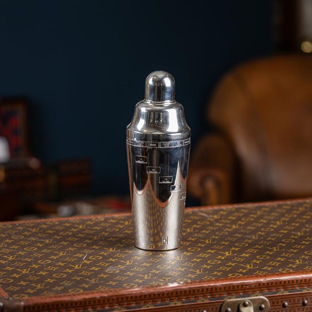 A stylish 20th century art deco silver plated recipe cocktail shaker by napier co., meriden, connecticut, usa. With...