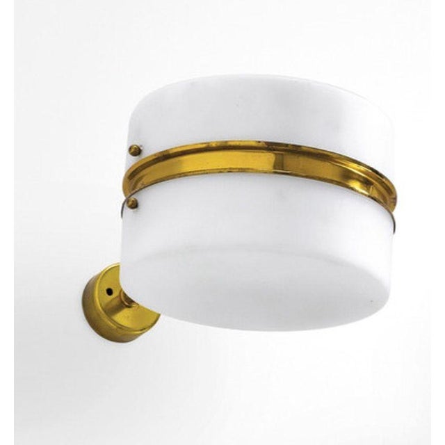 Rare set of three Italian Mid-Century Modern wall sconces designed by Stilnovo, dating to circa 1960's. Each sconce...