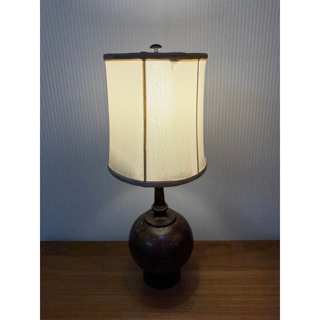 Design Plus Gallery presents a Vintage Genie Lamp from the Mid 20th Century. The body of the lamp has a bulbous base and...