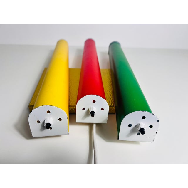 This exceptionally rare Century Modern wall lamp from the 1960s is a true Italian masterpiece. Featuring three colorful...