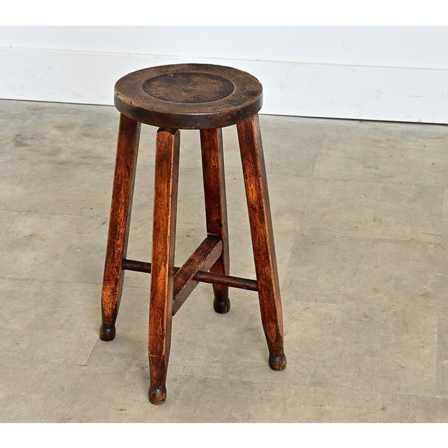 English, late 19th century carved oak low stool; a charming and versatile piece of accent furniture for anywhere in the...