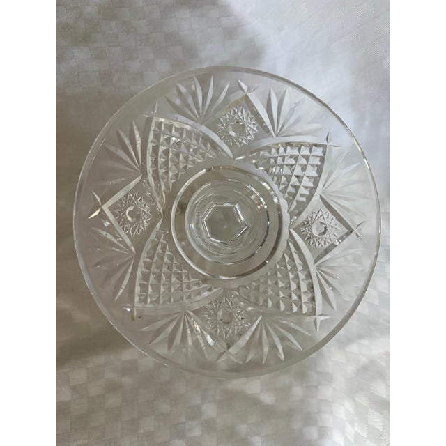 A Vintage Waterford crystal pedestal compote in the Hobstar and Fan Arch pattern. The piece has a faceted starburst...