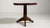 A compact round side table combining simple structure with decorative character. The round top softens its presence within...