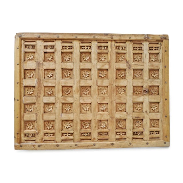 Original carved wood ceiling panel from India with natural finish. Carved flower pattern and iron work detail. Great used...