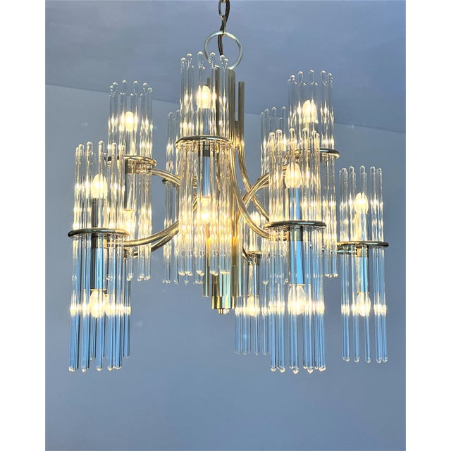 This is a stunning mid 20th century chandelier circa 1970 Italian designer Gaetano Sciolari styled. It has 10 arms of...