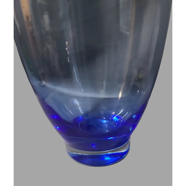 Add a touch of elegance to your home decor with this beautiful Mediterranean Blue Hand-Blown Art Glass Vase. With a...