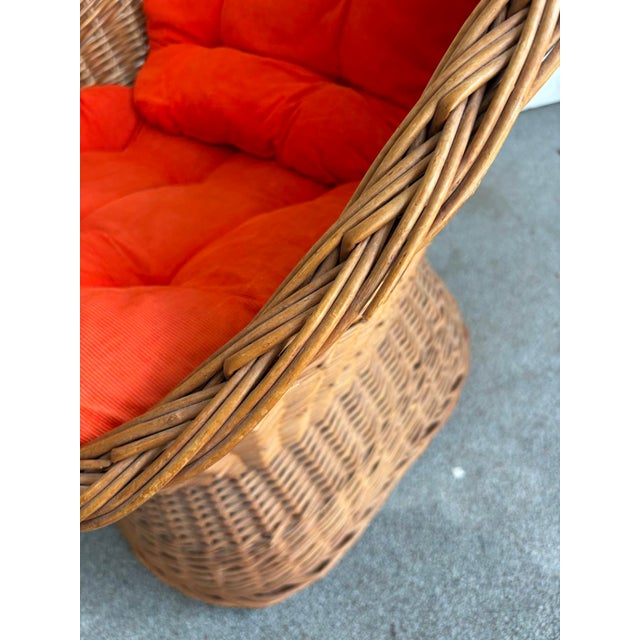 1950s-60s midcentury wicker pod chair w/ original orange velvet cord cushions. Some minor edge breaks to wicker in a...