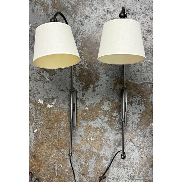 Design Plus Gallery presents a pair of Adjustable Arc Plug-In Wall Sconces from Pottery Barn. These sconces showcase...