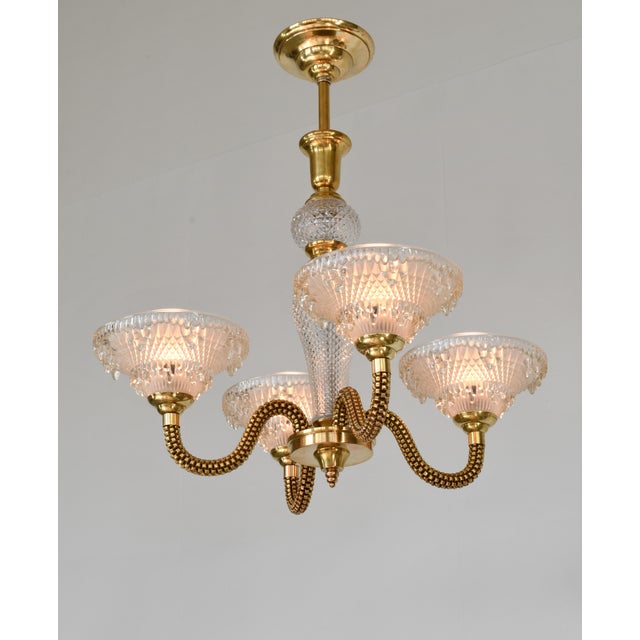 Jean Boris Lacroix A very rare French art deco chandelier made around 1935-1940 in brass and clear frosted molded-pressed...