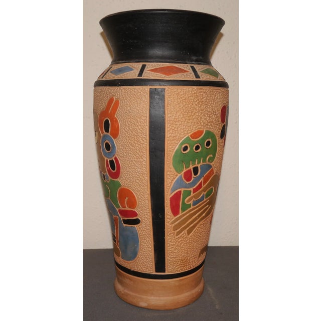 Up for sale is a Vintage 1960's Guatemalan Mid Century Modern Clay Aztec Motifs Baluster Vase! It measures 14" tall. The...