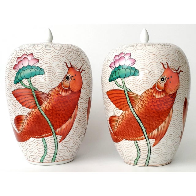 Offering a a pair of large 14" hand painted vintage Chinese porcelain ginger jars, circa Mid 20th Century. These jars are...