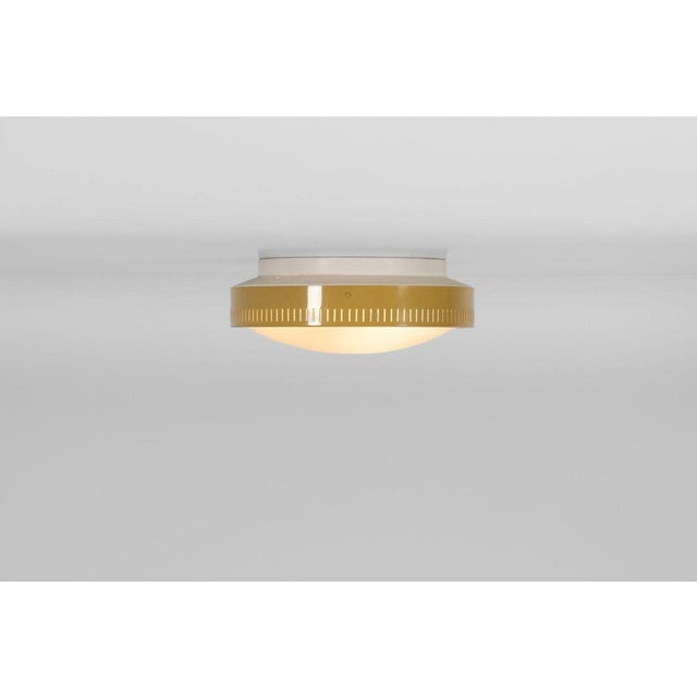 These minimalistic ceiling lamps model 1152, designed and produced by Stilnovo in Italy around 1950, embody the refined...