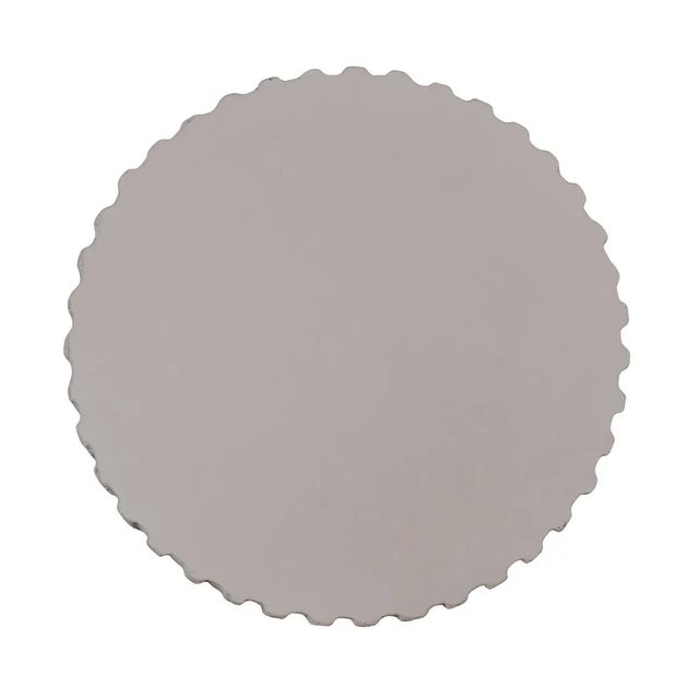 Durable cement resin side table pairing sculptural form with lasting outdoor performance. Rounded silhouette is softened...