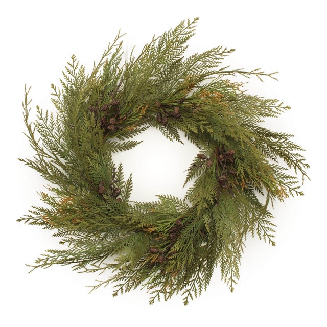 Bring the essence of the outdoors into your home this holiday season with the Cedar and Mini Pinecone Wreath. Featuring...