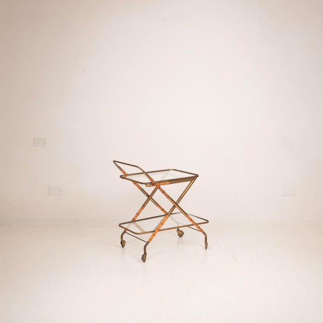Refined bar cart by Cesare Lacca, made in Italy in the 1950s, a full expression of the most sophisticated Italian mid-...