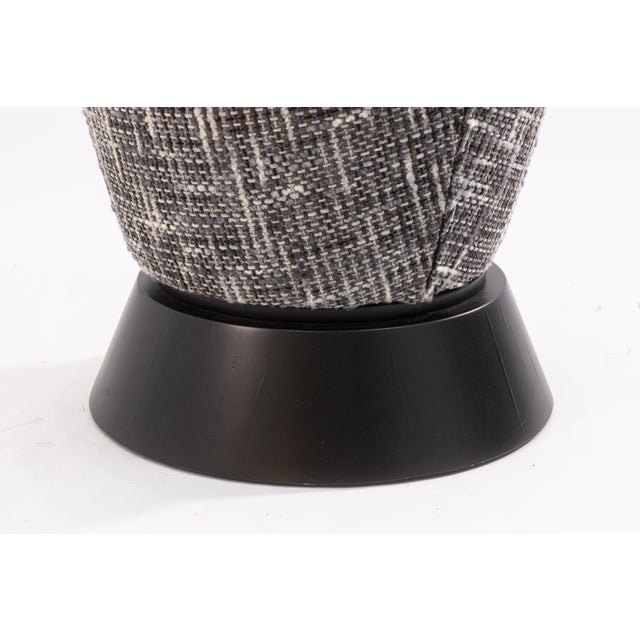 A contemporary modern swiveling vanity stool. This cute little stool features a simple black and white color scheme. It is...