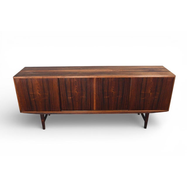 Origin: Denmark Designer: E.W. Bach Manufacturer: Sejling Skabe Era: 1960s Materials: Rosewood Measurements: 77″ wide x...